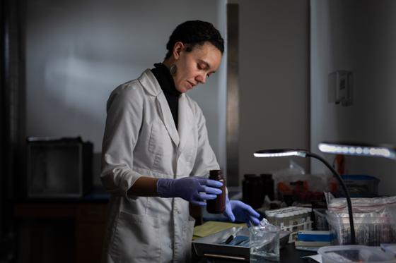 Photo of Chatham University Professor Erin Williams-Hatala working in a lab