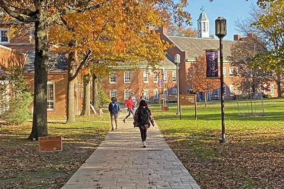Photo of students walking across the Shadyside Campus quad in autumn