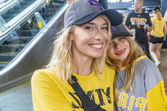 Photo of a Chatham University employee and a child at a Pirates game